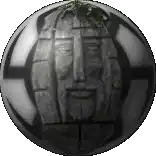 a sphere with a face carved into it