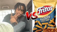 a man sitting next to a bag of fritos chips