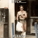 a police officer in shorts and cowboy boots is holding a bag and a gun .