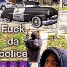 a man is standing in front of a police car that says " fuck da police " on it