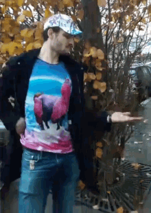 a man wearing a t-shirt with a horse on it