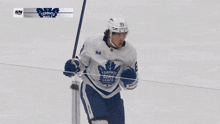 a hockey player with the number 2 on his back hugs another player