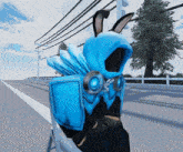 a person in a blue hoodie with bunny ears