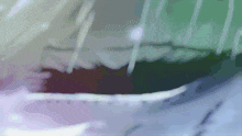 a blurred image of a person 's mouth with a purple and green background
