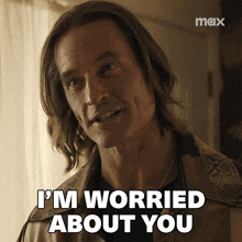 a man says " i 'm worried about you " in front of a max logo