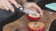 cutting up rose plum two plaid aprons slicing the plum cutting fruit