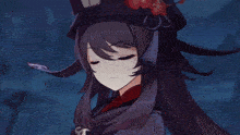 a close up of a girl wearing a hat with a heart on it .