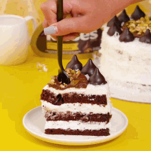 a slice of cake on a plate with a spoon on top
