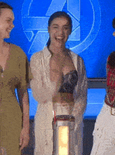 a woman is laughing while holding a lantern in front of a sign that says 4 on it .