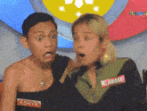 a man and a woman are standing next to each other and the woman has a name tag that says klarisse