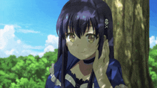 a girl with a skull and crossbones headband looks at the camera