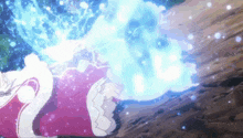 a woman in a pink dress is laying on the ground with a blue light coming out of her mouth