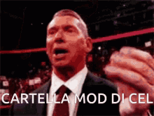 a man in a suit and tie is making a funny face with the words cartella mod di cel above him