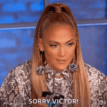 a woman in a snake print shirt says sorry victor .