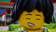 a close up of a lego girl with her eyes closed smiling