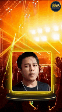 a picture of a man in front of a crowd with a sgm logo on the bottom