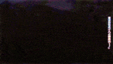 two anime characters with purple hair are standing next to each other in a dark room .