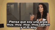 a woman in a bikini is talking in spanish