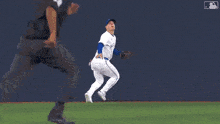 a close up of a baseball player throwing a ball .