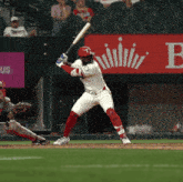 a baseball player with the letter t on his jersey is swinging his bat