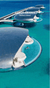 a saudi arabia shebara island poster with a swimming pool