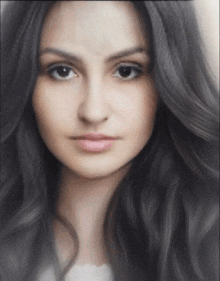 a close up of a woman 's face with long hair