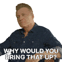 a man wearing a denim shirt is asking why would you bring that up