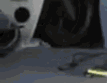a blurry picture of a speaker and a cell phone