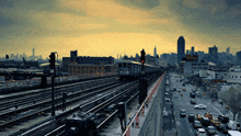 a train going down the tracks with a sign that says ' subway ' on it