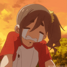 a girl in a red and white shirt is crying with a tear coming out of her nose