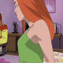 a woman in a green tank top is standing in front of a desk with a microscope on it