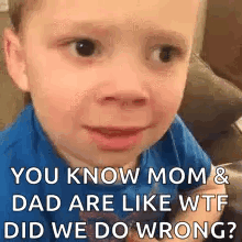 a little boy is making a funny face while sitting on a couch .