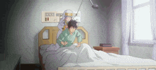 a man is laying in a hospital bed while a woman stands behind him