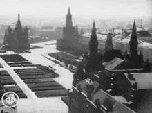 a black and white photo of a city with a sign that says tp