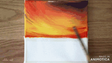 a painting of a sunset is being made in animatica