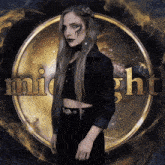 a woman is standing in front of a midnight logo