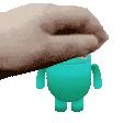 a hand is holding a blue cartoon character .