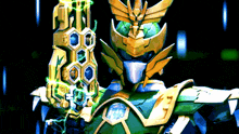 a green and gold robot is holding a glowing object in his hand