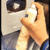 a person is holding a spray bottle that says " pencil & pencil "