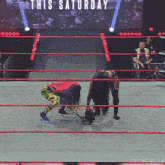 two women in a wrestling ring with the words this saturday on the screen behind them