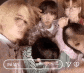a group of people are posing for a picture and one of them is wearing glasses