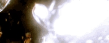 a close up of a person 's face in a dark room .