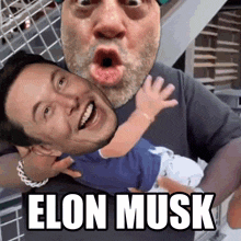 a man is holding a baby with elon musk written below him