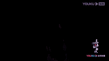 an advertisement for youku shows a man in a white robe flying through the air