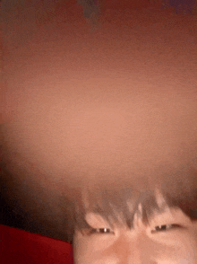 a close up of a person 's face with a very large head