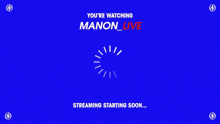 a group of people are gathered in a dark room and the words manon live are visible