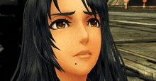 a close up of a girl 's face with a black spot on her chin