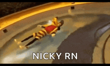 a cartoon character is laying on the ground in a pool with the words `` nicky rn '' written on the bottom .