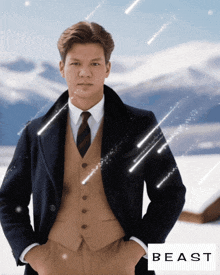 a man in a suit and tie is standing in the snow with the word beast on the bottom