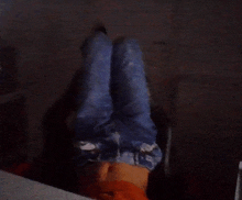 a person laying upside down with their feet up
